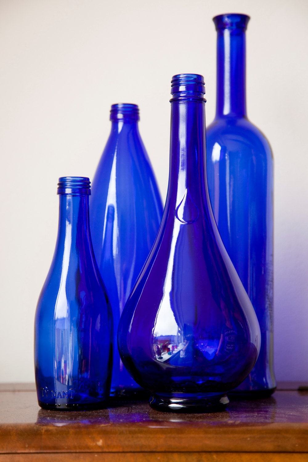 Set of 4 cobalt blue bottles/vases
