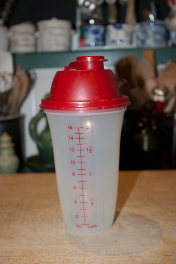 Tupperware Shaker bottle with red flip top lid agitator and