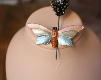 Iridescent butterfly brooch.