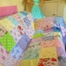 Vintage fabric patchwork bed cover. Pink, lilac, green, yellow, blue. Original and unique