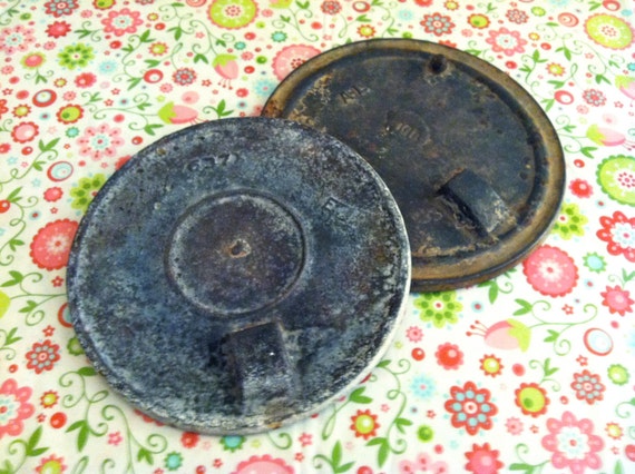 Pair of Rusty Cast Iron Stove Lid Covers