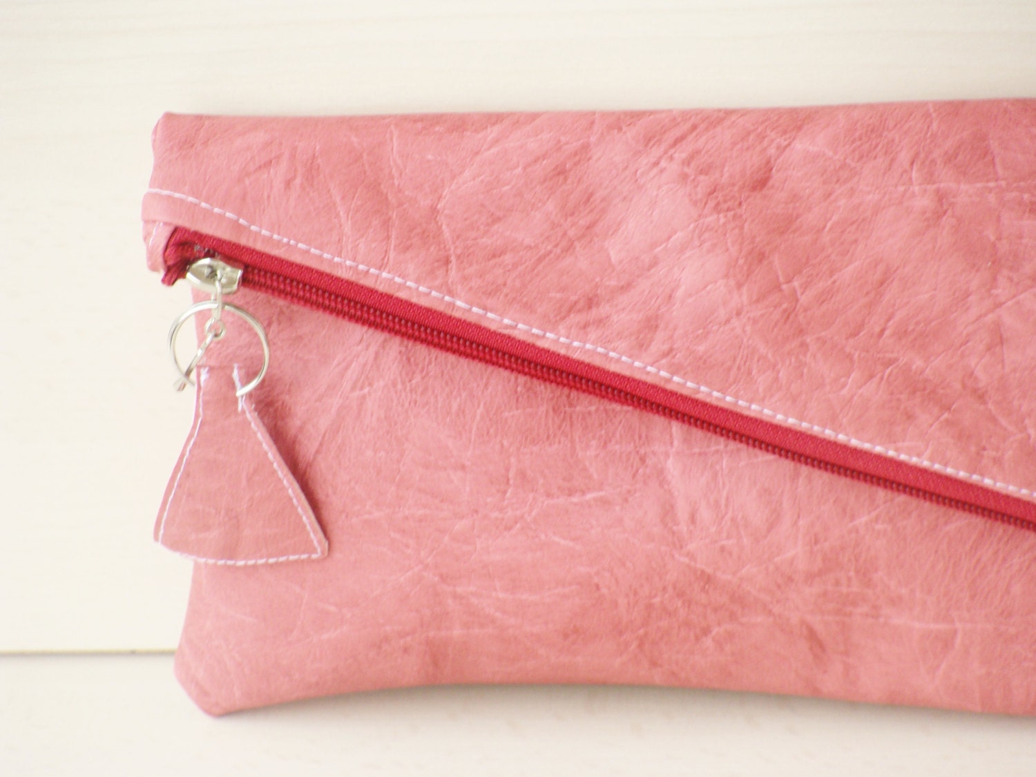 blush coloured clutch bag