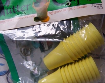 tiny little yellow plastic party cups