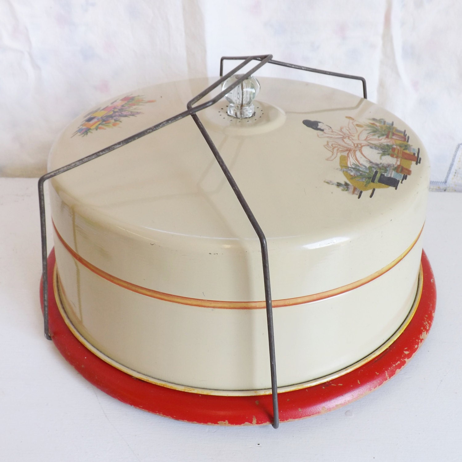 Vintage metal cake carrier with flowers and lady gardening