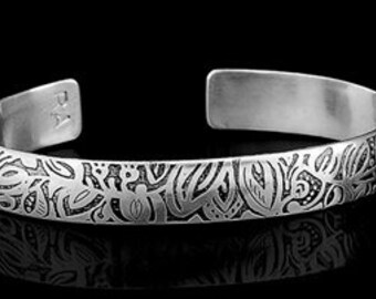 Etched Silver cuff bracelet.