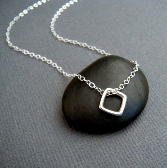 tiny silver necklace. square diamond shape. silver geometric
