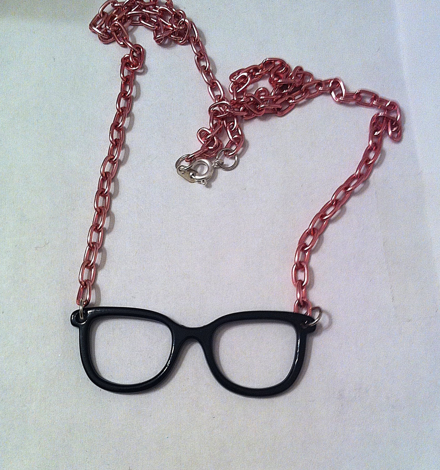 Black frames glasses necklace with pink chain glasses