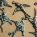 4 pc. Peacock Patina 2 Loop Bird Connector Facing Right | PAT-006