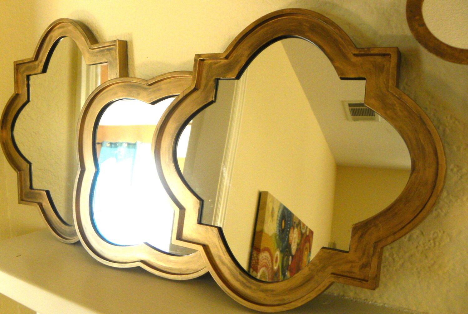 Three Decorative mirrors in Antique gold finish.