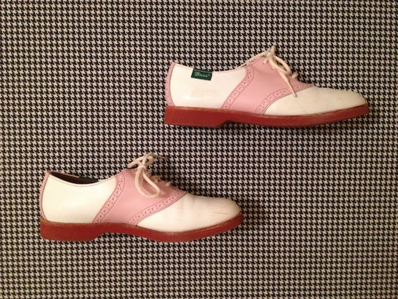 pink and white saddle shoes