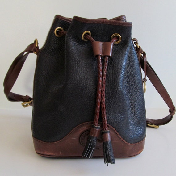 Dooney and Bourke Black and Brown Pebbled Leather Bucket Bag/