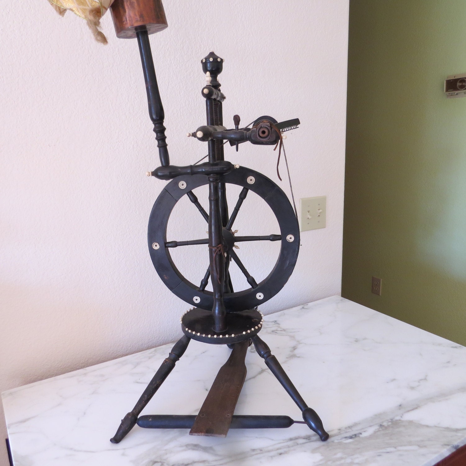 Antique flax spinning wheel from France with ivory accents