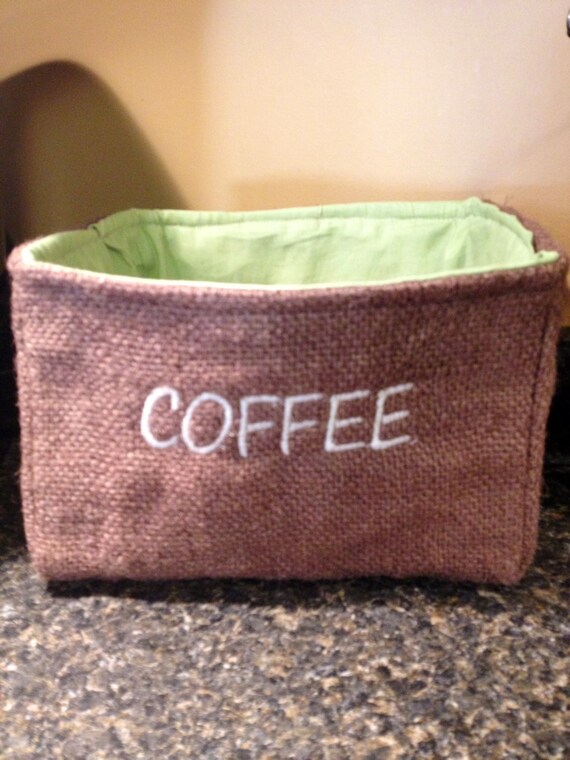 Embroidered burlap basket for storing Keurig k cups. Coffee