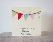 Handmade bunting birthday card, with colourful bunting and white bow.