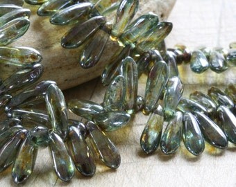 Czech glass dagger bead strand 3mm x 10mm transparent sage green luster 100 beads.