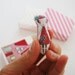 Miniture Camille pocket doll in her little matchbox home