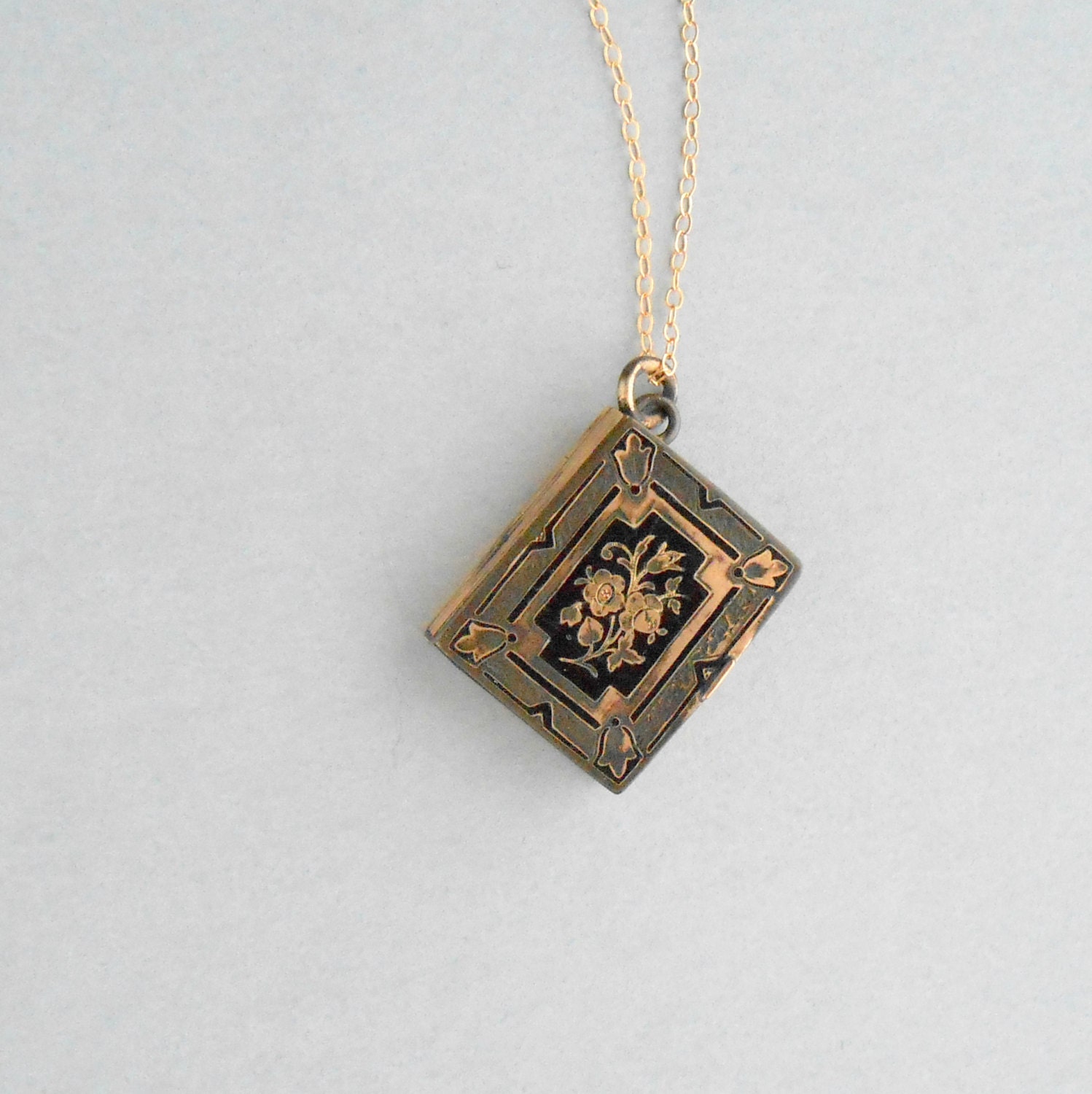 Antique Book Locket. Enameled Flowers. Black. Holds by pinguim