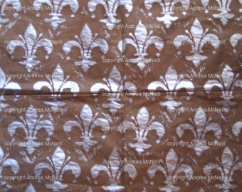 Sheet brown tissue paper, handprinted with silver Fleur de Lys linoprint