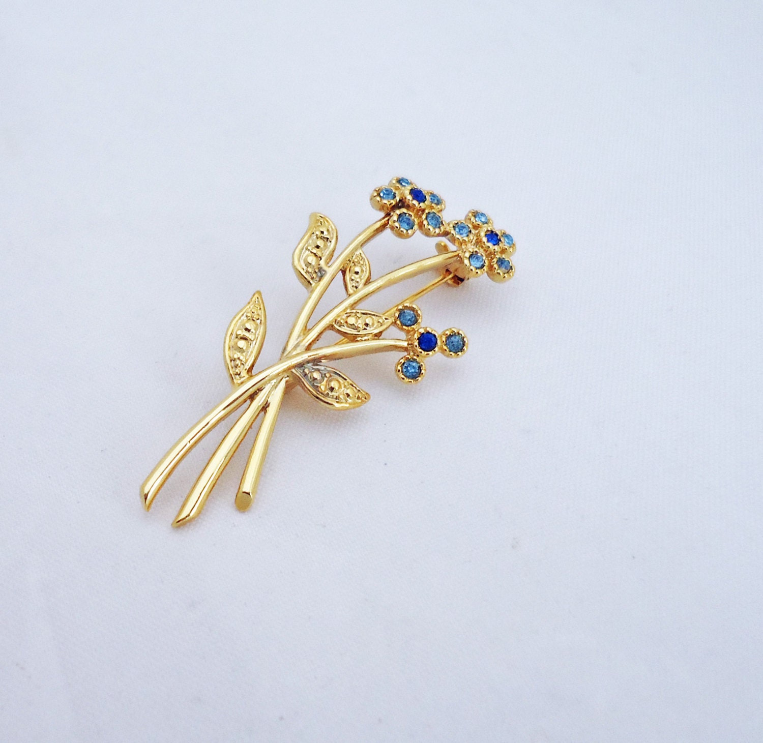 Vintage Movitex Blue Rhinestone Flower Brooch by thesecretcupboard