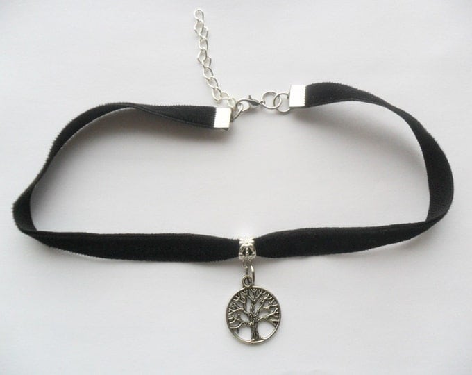 Black velvet choker necklace with tree of life pendant and a width of 3/8”inch.