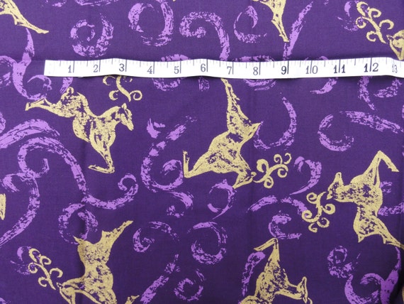 Purple fabric with gold reindeer Christmas fabric sold by