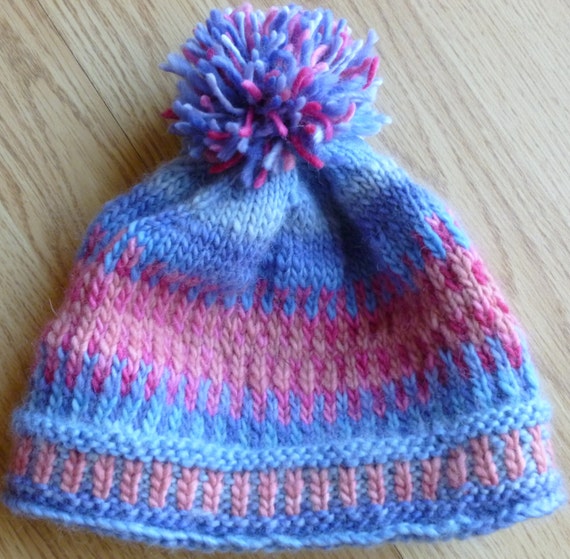 Items similar to Kids' merino wool hand-knit beanie with pom-pon on Etsy