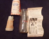 Glass baby bottle Hygeia nursing bottle 1940s includes pamphlets and original cardboard insert Ball Brothers Glass baby bottle Hygeia nursing bottle 1940s includes pamphlets and original cardboard insert Ball Brothers