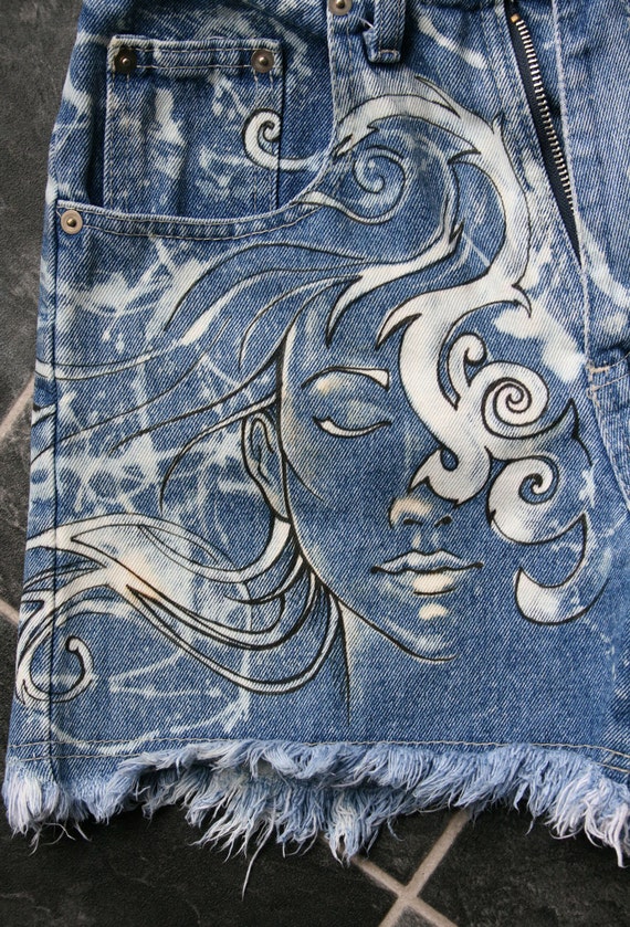 Hand painted, bleached, high waisted, denim shorts.