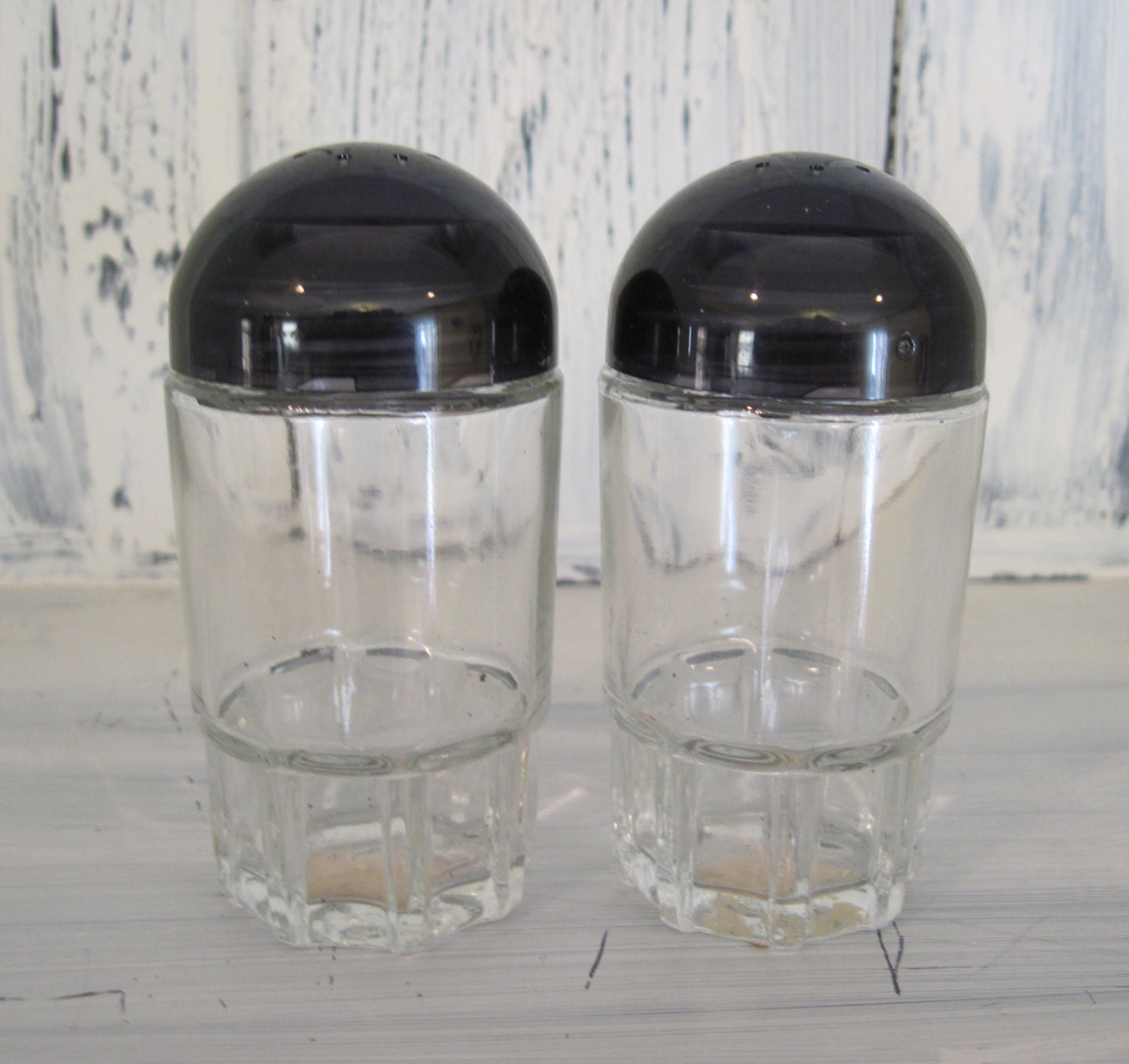 Vintage glass salt and pepper shakers, glass shakers with black plastic
