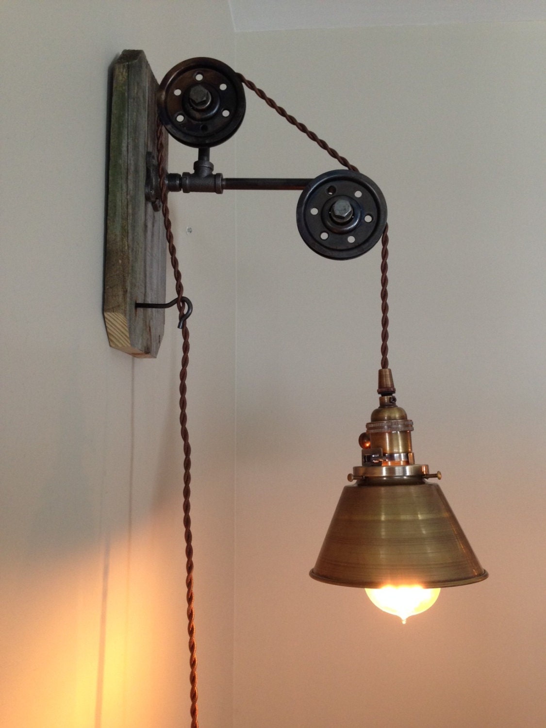 Small wall hanging industrial pendant light with pulleys and