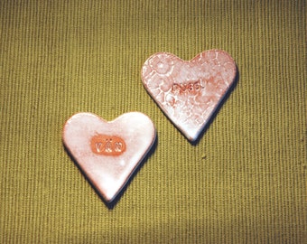 Ceramic heart ornaments - set of two, white, medium sized and with text.