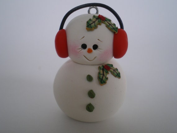 Tiny snowman ornament with red ear muffs polymer clay by