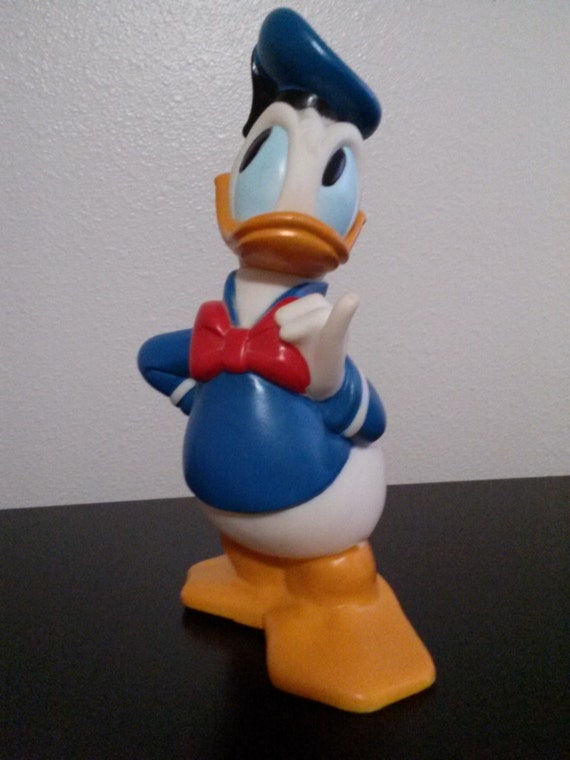 Items similar to Vintage Walt Disney Donald Duck Rubber Coin Bank on Etsy