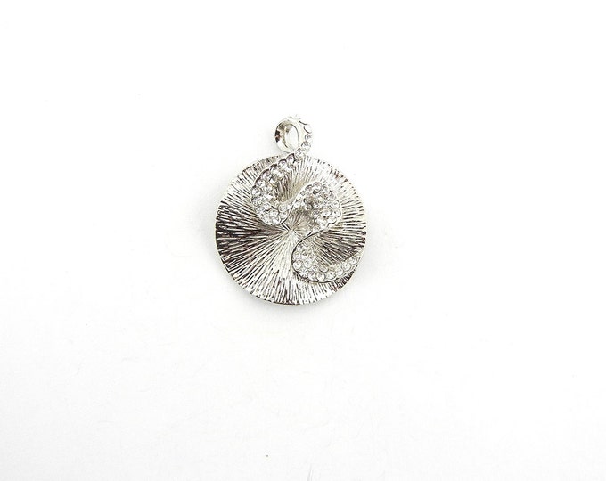 Round Textured Silver-tone Pendant with Rhinestone Swirl