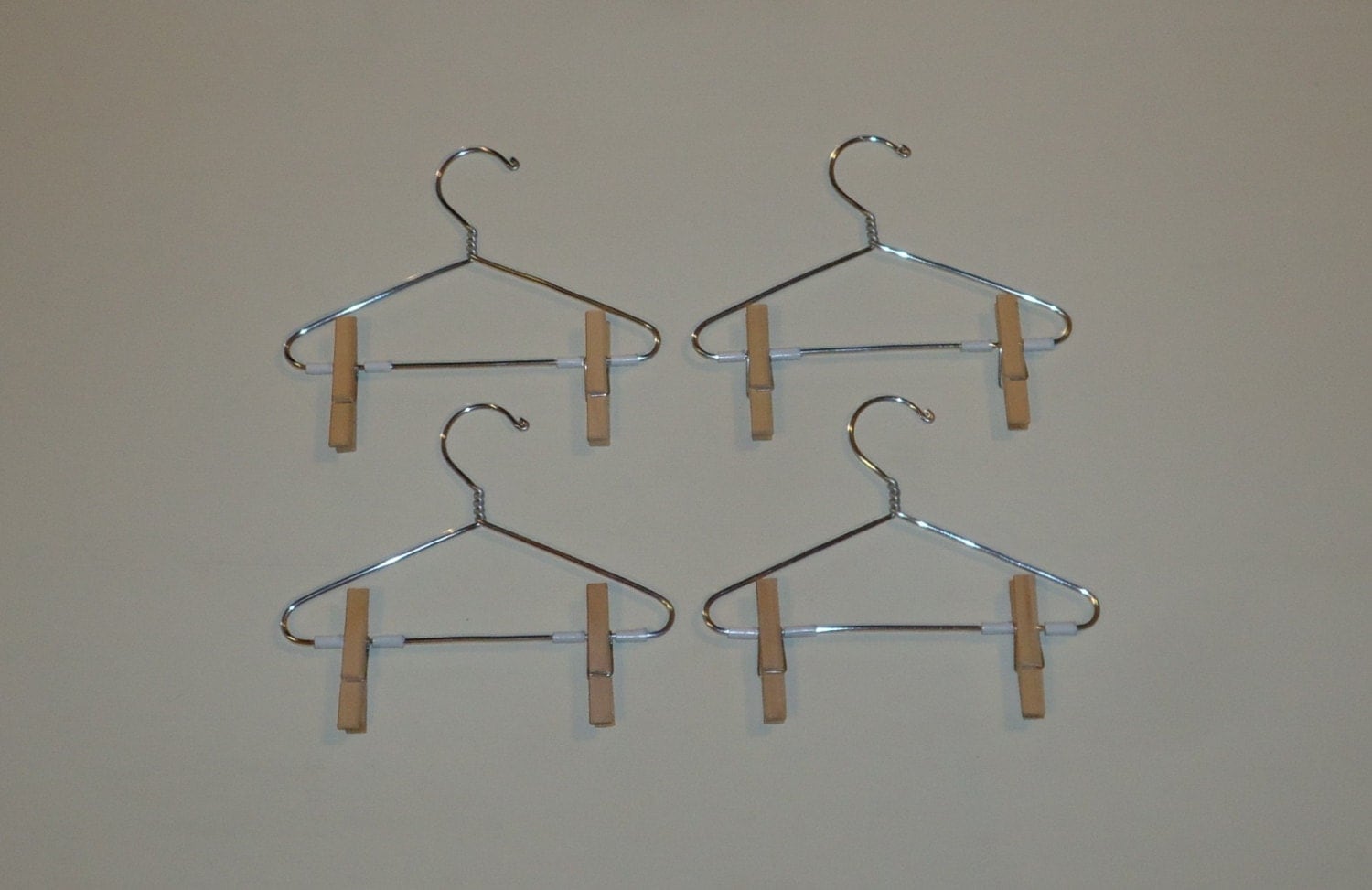 metal doll hangers