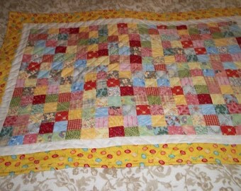 doll size quilt in 1 inch patchwork.