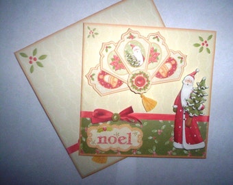 Hand cut and layered Santa with fan Christmas card.
