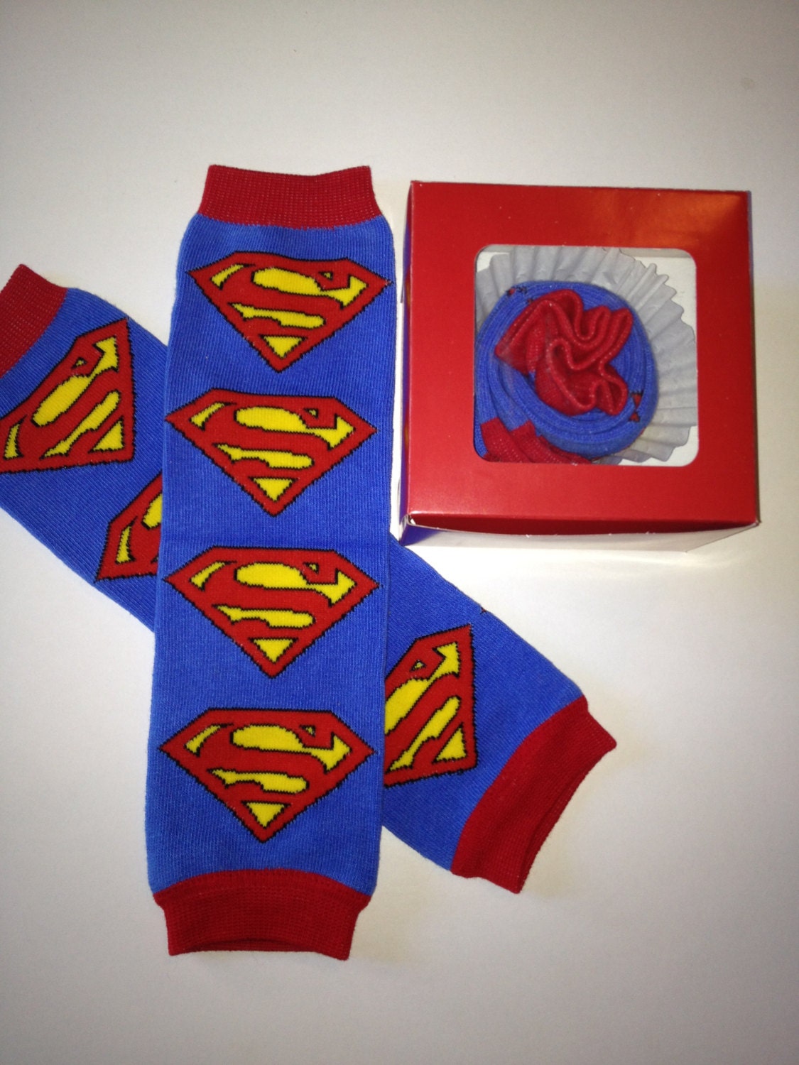 Blue And Red Superman Leg Warmers Packaged Like A Cupcake 3598