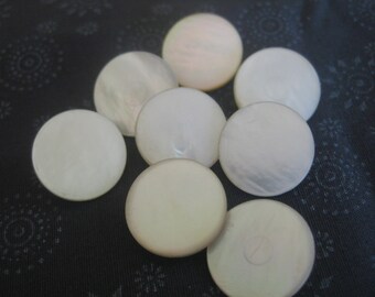 Eight vintage mother of pearl buttons