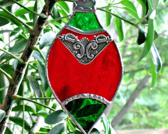 Holiday ornament in stained glass. Red Christmas holiday suncatcher keepsake window ornament. Stained glass vintage ornament.