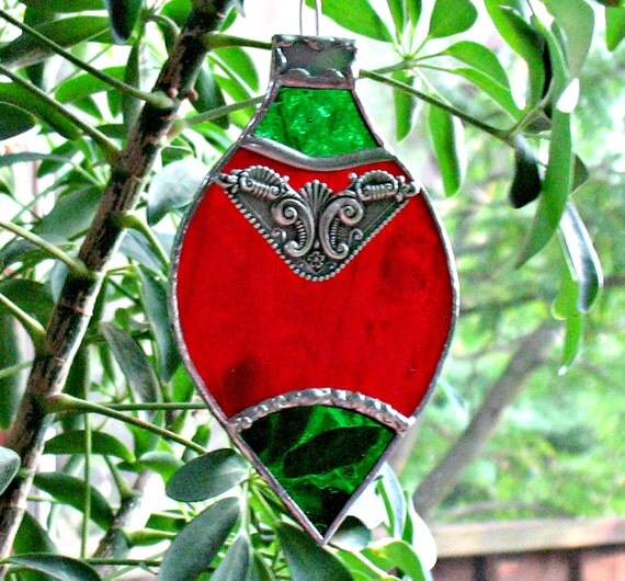 Holiday ornament in stained glass. Red Christmas holiday
