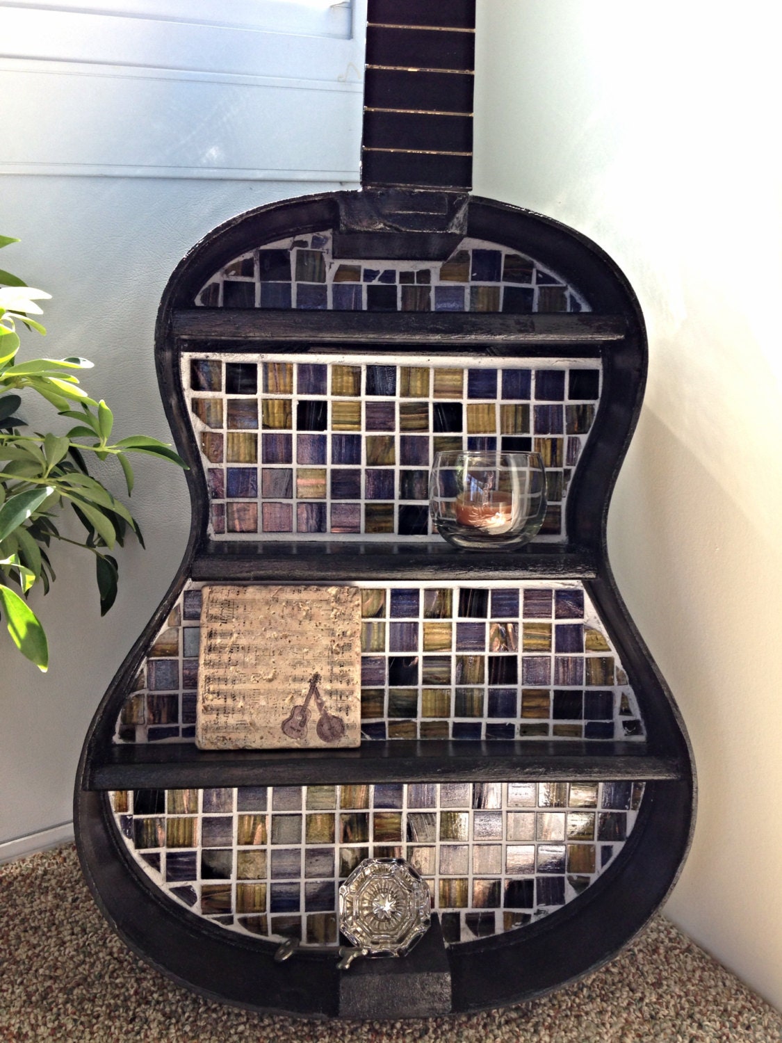 Repurposed guitar shelf with mosaic tile backsplash