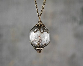 Real Dandelion Seeds Antique Style Bronze. Handblown glass orb, double bronze bead cap, long necklace