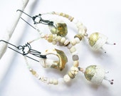 A Precious Day. Rustic Gypsy Victorian Tribal white assemblage earring with beach shells, silkworm cocoons and gold leaf.