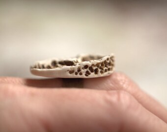 Fragment- An earthy porcelain ring with textured surface.