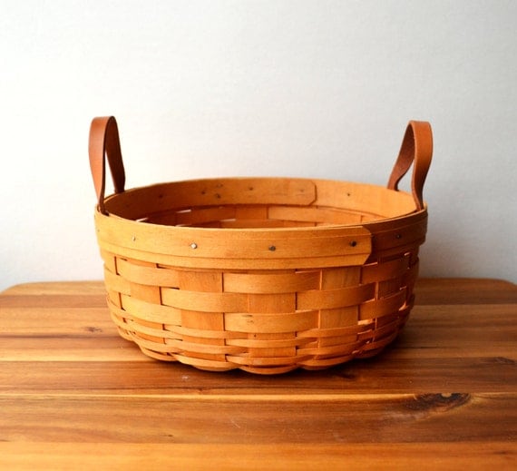 Wooden basket weaved with brown leather handles / folk
