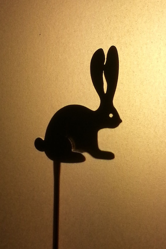 Items similar to Handcut Brass Bunny Shadow Puppet with Copper Handle