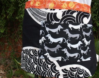 Woman's half apron in black and white, heavy canvas, Dachshound dogs pocket, orange and yellow long ties