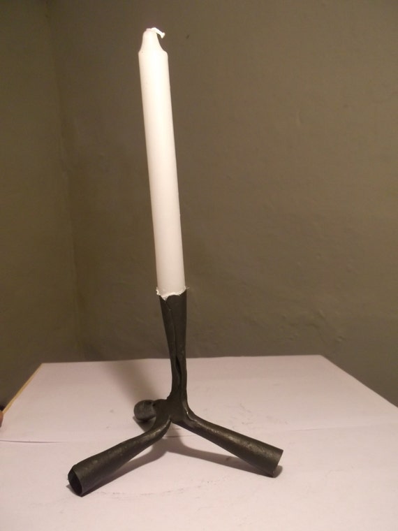 Reproduction roman candle holder caltrop style.