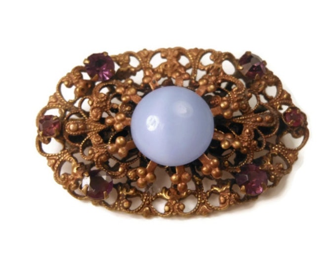 1940s Coro brooch, blue moonglow cabochon brooch with filigree scroll work and amethyst rhinestones, gold tone